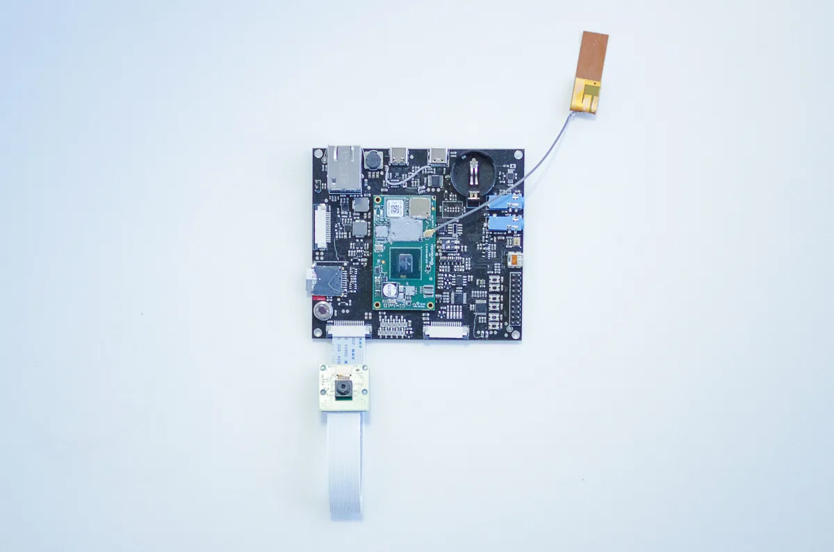 Tokay Pro processor board with antenna and a ribbon-cable camera module
